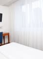 bed, desk, chair, TV, outlet