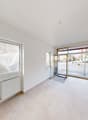 empty room, white tiled floor, windows, heating system