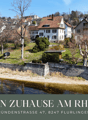 Houses on the riverside, with a view of the river and the town