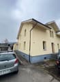 Single family house, yellow paint, windows, door, 2 cars parked