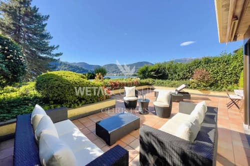 Carabietta: elegante Wohnung mit Terrasse, privatem Garten & Blick auf den Luganersee zu verkaufen
