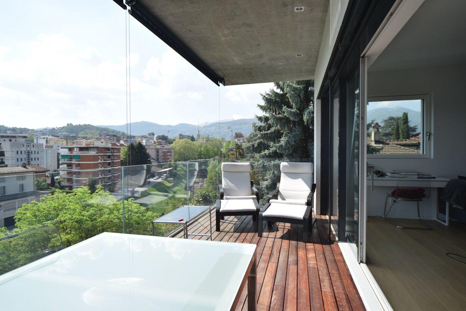 Attico vista lago con roof garden