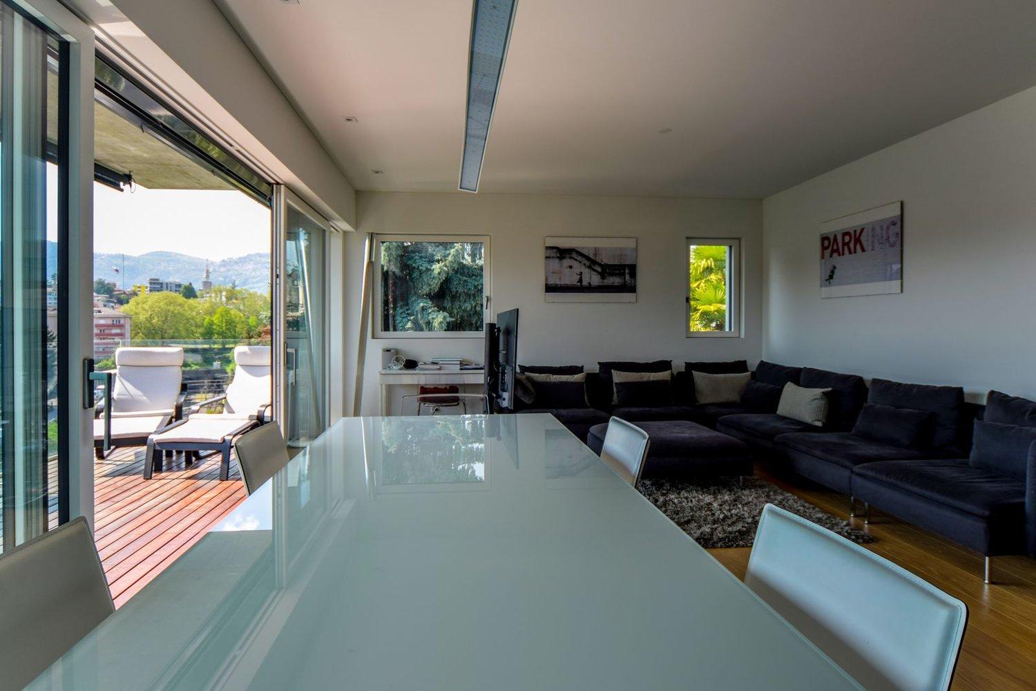 Attico vista lago con roof garden