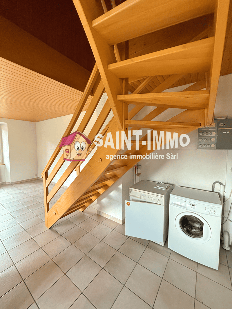white tiled floor, wooden stairs, washing machine, dryer