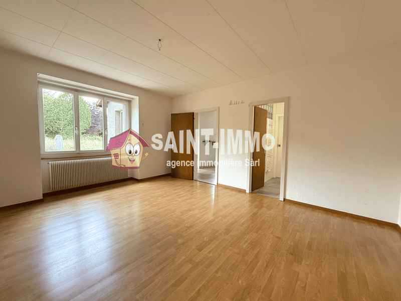 empty room, wooden floor, white walls, double glass window with outside view, wooden doors, wall-mounted radiator, hallway