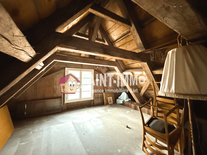 wooden ceiling, wooden walls, small window, wooden chair, lamp, wooden storage boxes