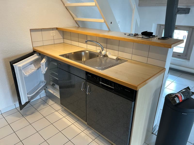 kitchen with sink, dishwasher, refrigerator, wooden countertop, tiled floor