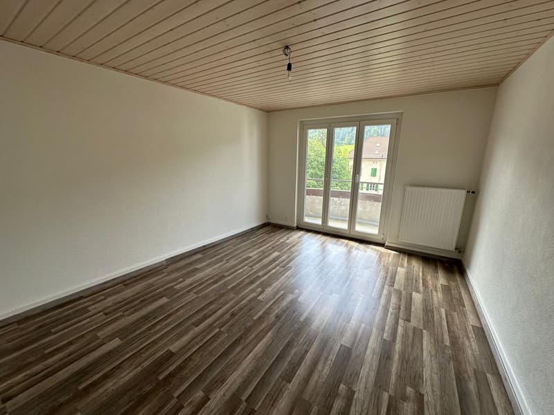 empty room, wooden floor, sliding glass door, balcony, white walls, wooden ceiling