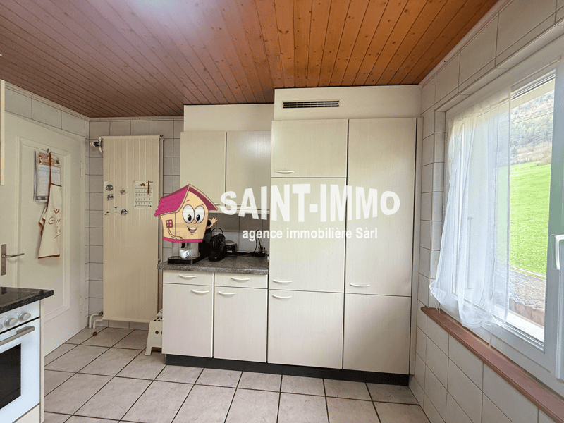 modern kitchen with white cabinets, tiled floor, window with view, white appliances