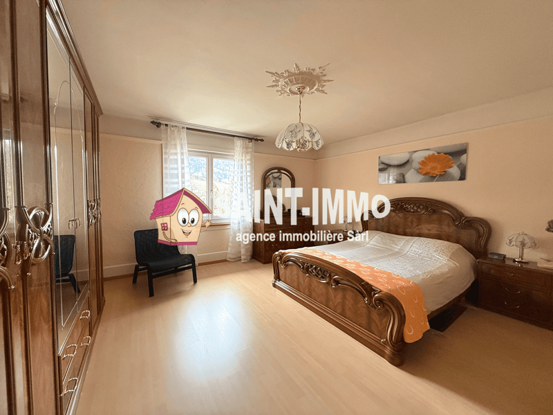 wooden bed, wooden nightstand, wooden cabinet, mirror, chair, chandelier, window with curtains, picture frame