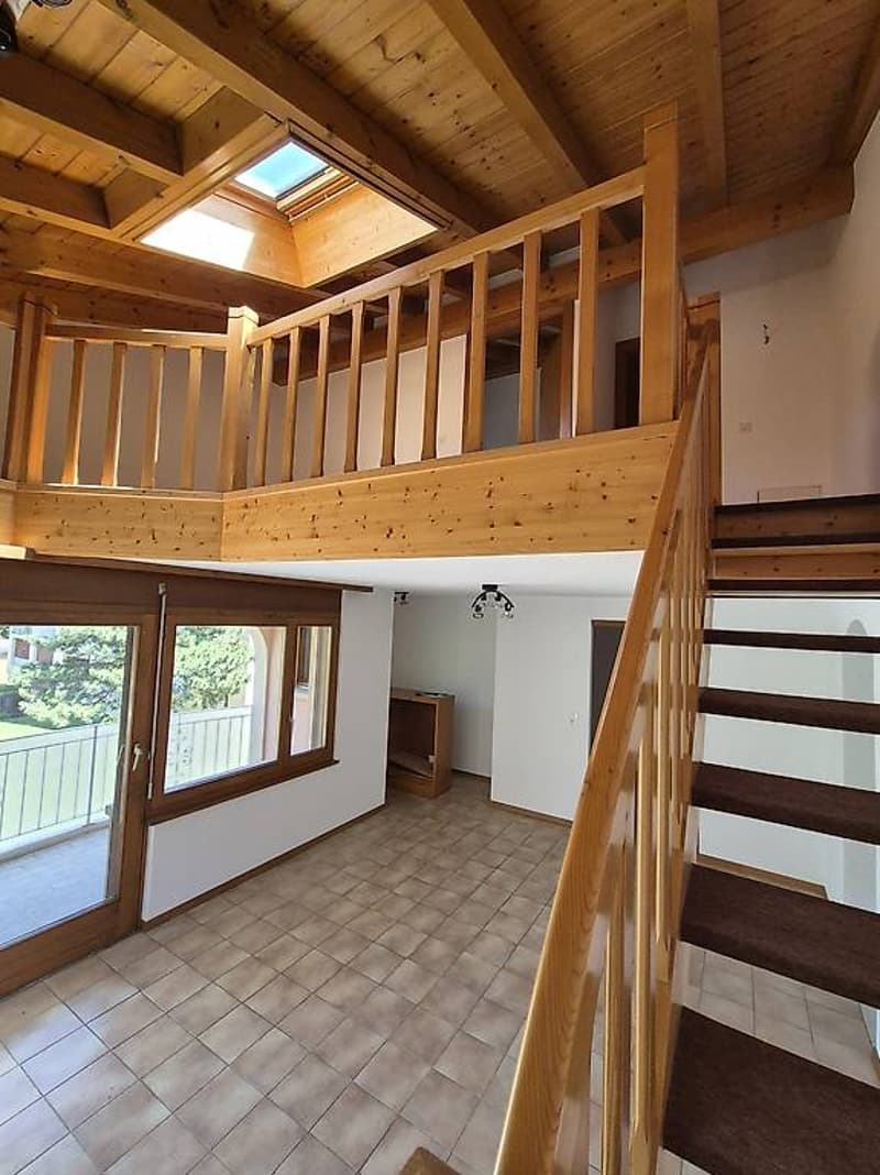 loft style with a balcony, wooden flooring, glass door, large windows, wooden staircase, wooden loft