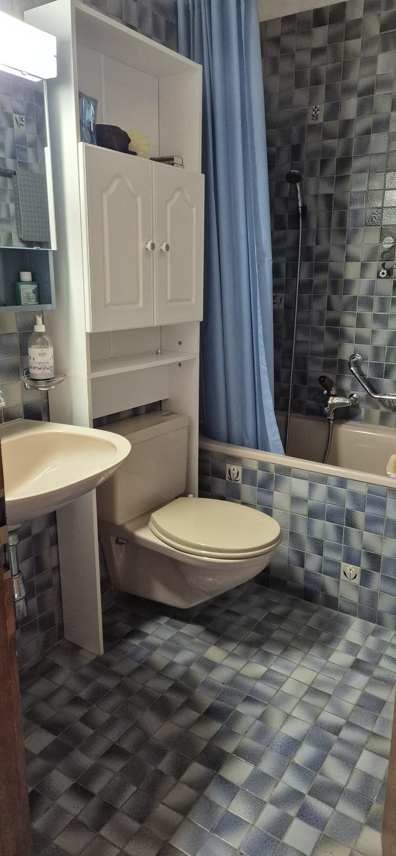 bathroom, tile floor, white sink, white toilet, shower, bathtub, shower curtain