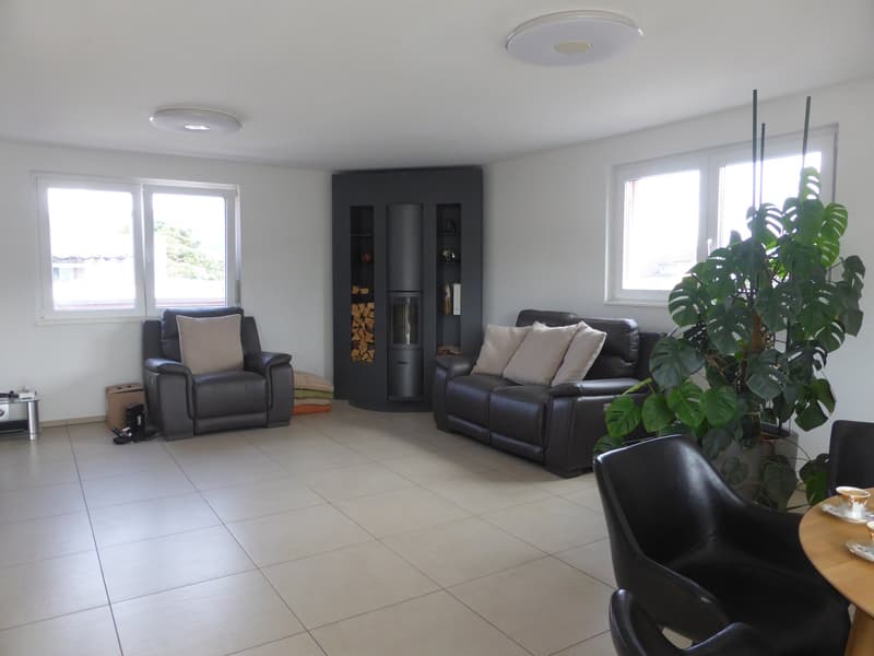 leather sofa, armchair, coffee table, fireplace, floor lamp, tile flooring