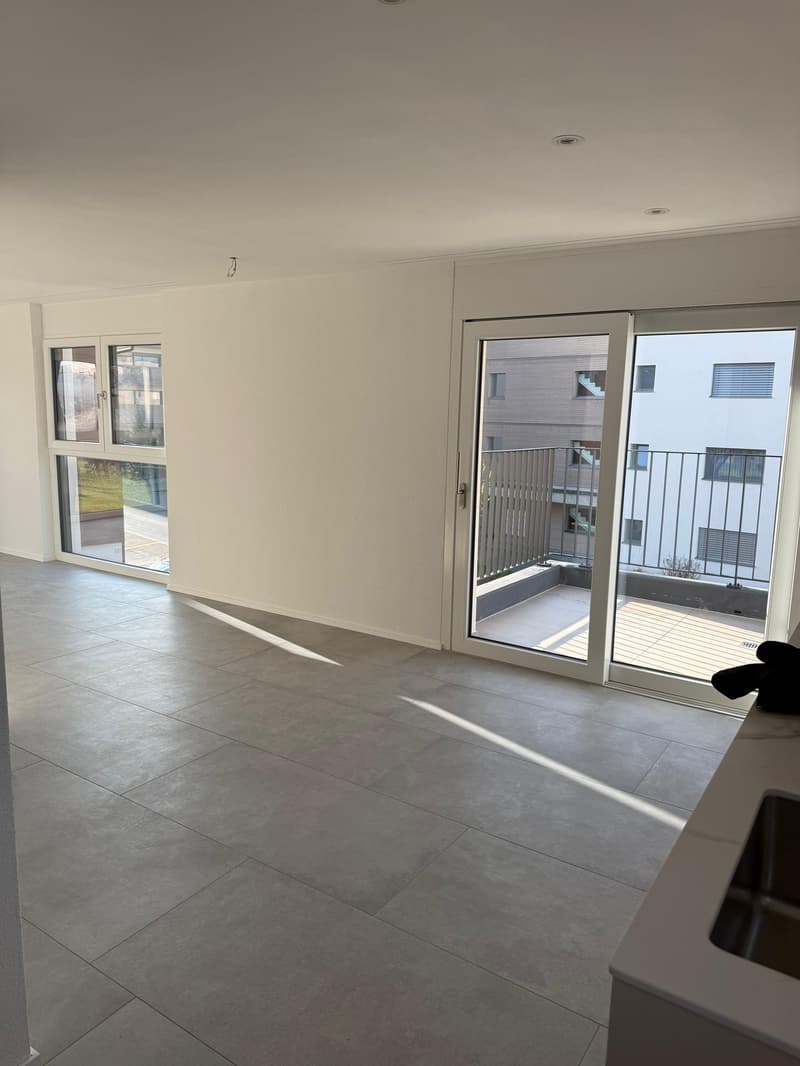 empty room, white walls, tiled floor, sliding glass doors, balcony