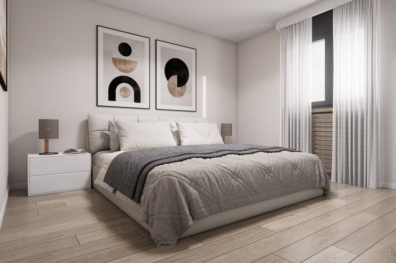 A bedroom with a bed, nightstands, lamps, and two paintings on the wall. The bed has a gray comforter and white pillows. The room has wooden floors and white walls. There is a window with white curtains.
