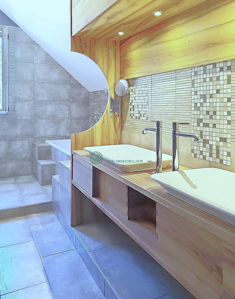 modern double wash basin, wall-mounted mirror, freestanding bathtub, raised floor, under-mounted sink
