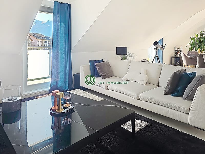 white sofa, black coffee table, large window, blue curtains, decorative items, telescope, potted plant