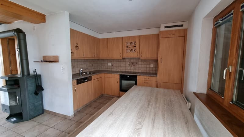 kitchen with sink, gas stove, oven, cabinets, countertop, fireplace, tiled floor