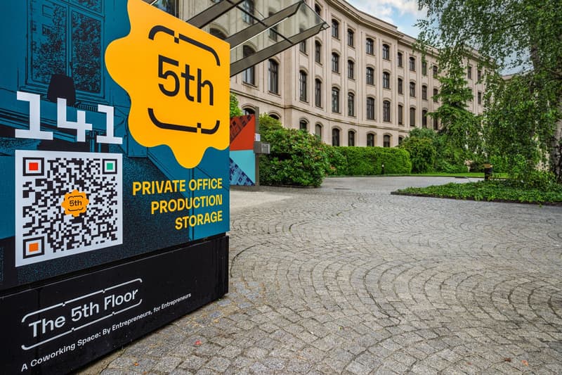 Signboard advertising private office production storage, 5th floor, in front of a large building
