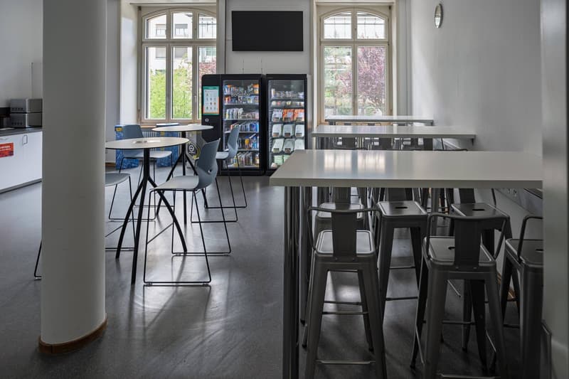 Modern interior with desks, chairs, and windows