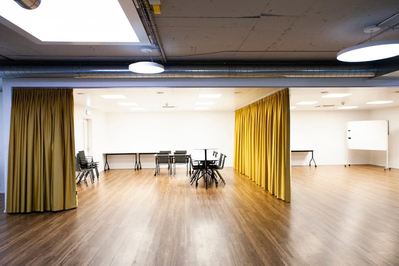 empty room, hardwood floor, yellow curtains, tables, chairs, whiteboards