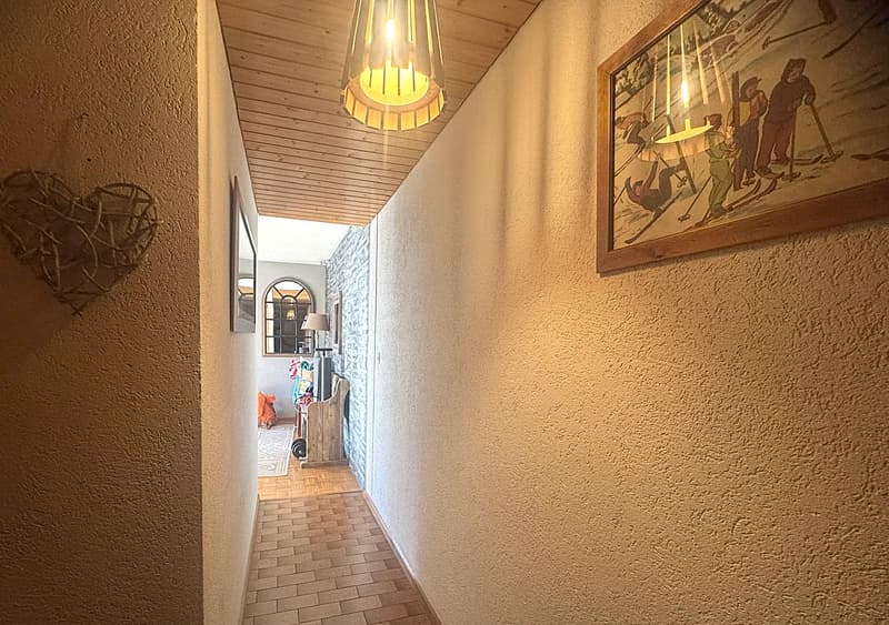 wooden ceiling, wooden floor, wall decoration, lamp, picture frame, hallway
