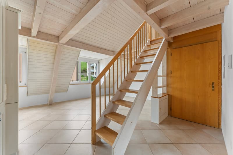 wooden staircase, wooden beams, tiled floor, wooden door, windows