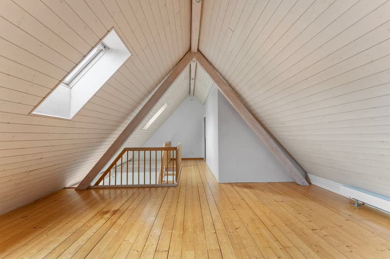 wooden floor, wooden beams, white walls, skylight, wooden railing