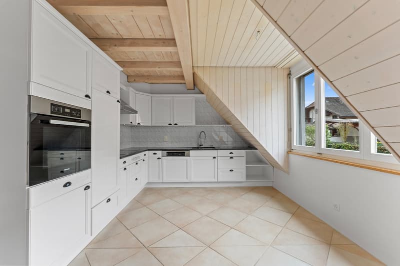 modern kitchen with white cabinets, tiled floor, stainless steel oven, dishwasher, wooden ceiling
