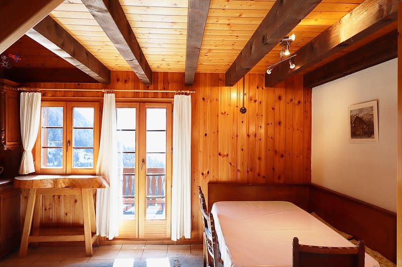 wooden ceiling, wooden wall, wooden desk, windows with glass doors