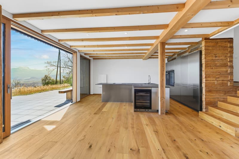 modern kitchen with large windows, wooden floor, stainless steel appliances, wooden beams