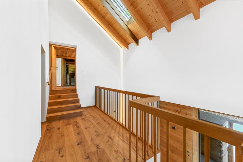 wooden floor, wooden ceiling, wooden railing, white walls, wooden stairs
