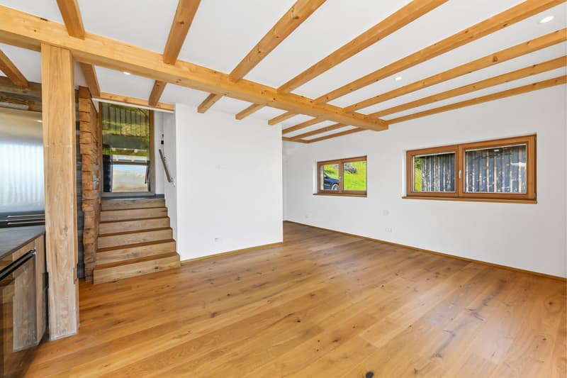 wooden floor, wooden beams, white walls, staircase, windows