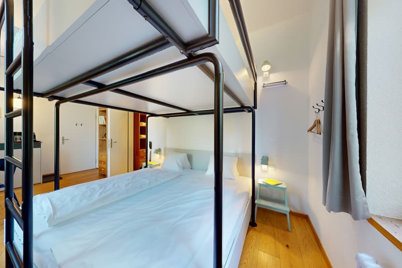 bunker bed, desk, night lamps, hanging hanger, cupboard, wooden floor