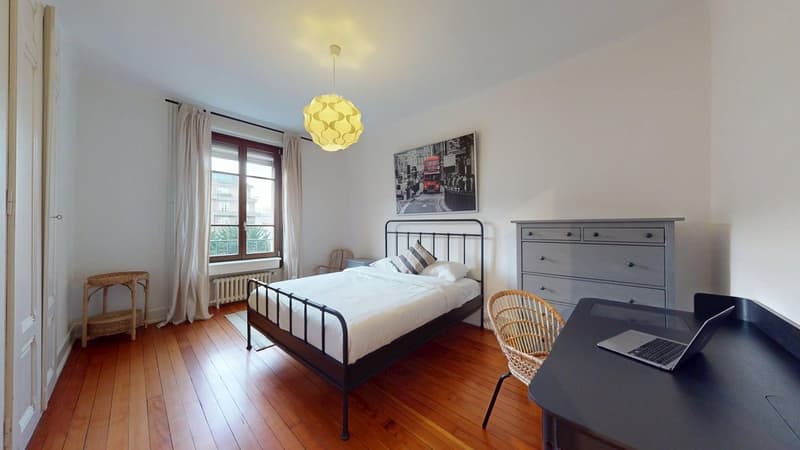 single bed, chair, desk, lamp, window, curtains, white walls, wooden floor, picture frame