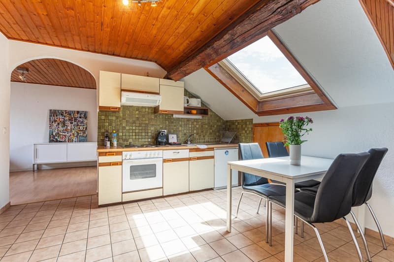 kitchen, dining table, tile flooring, white appliances, skylight
