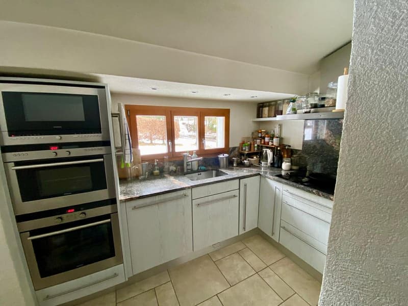 white cabinets, granite countertop, stainless steel appliances, wooden window, sink, faucet, shelves, tiled floor