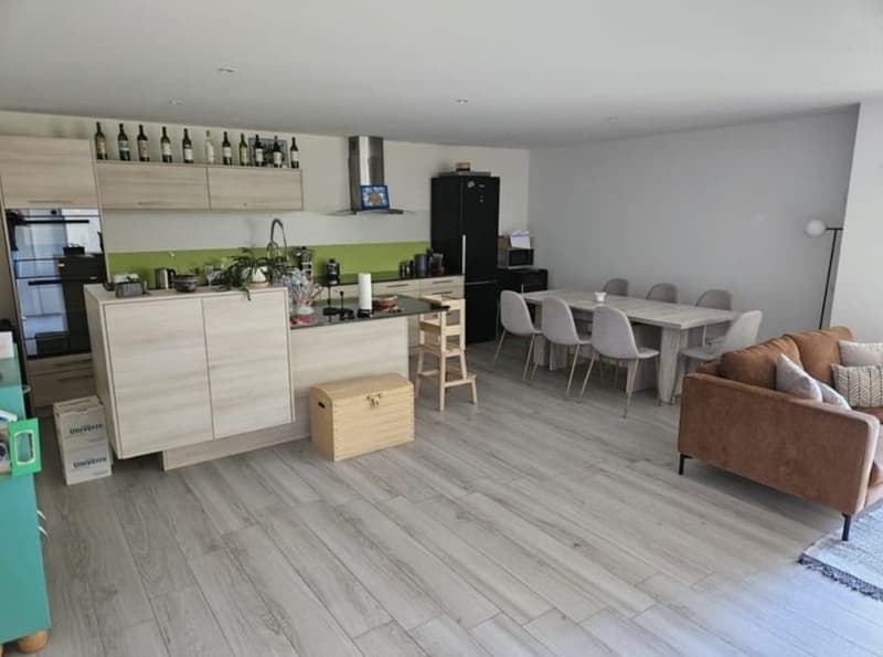 open kitchen, dining table, 6 chairs, sofa, carpet, wooden flooring