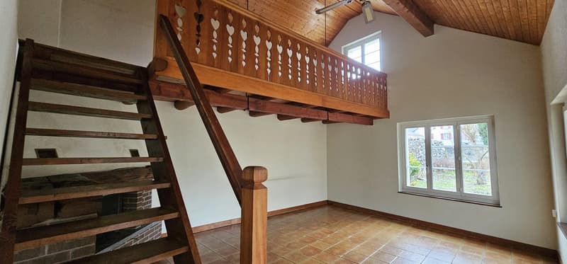 wooden stairs, fireplace, wooden loft, white walls, windows, wooden ceiling