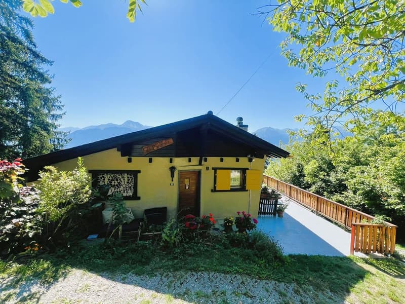 yellow house, wooden fence, wooden balcony, yellow shutters, garden, mountain view