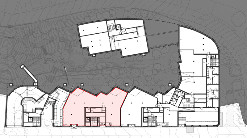 Floor plan showing multiple sections including a main area, smaller sections, and an entrance highlighted in red