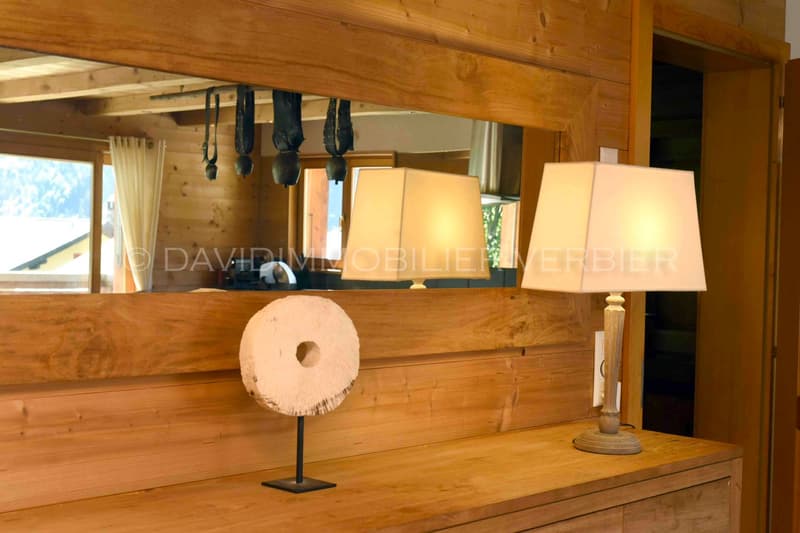wooden interior, large mirror, lamps, artwork, view of the outside