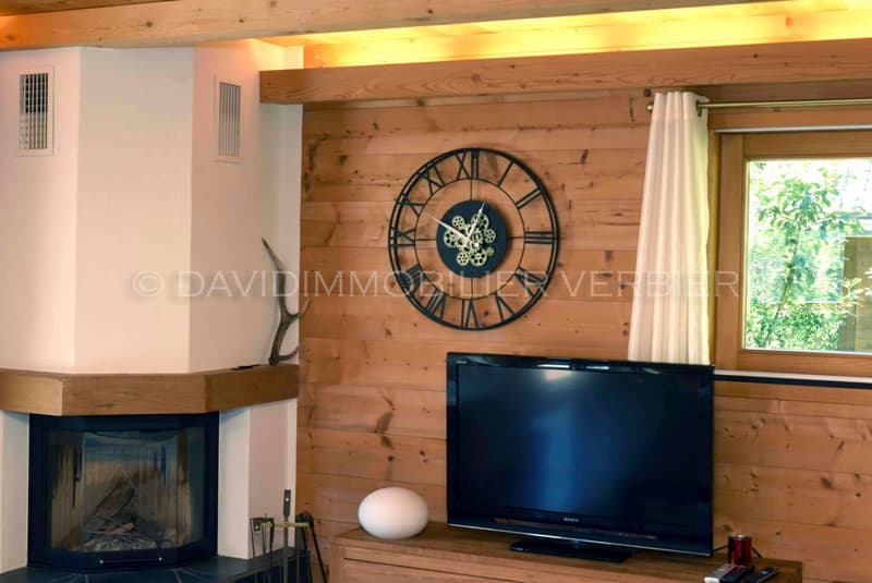 fireplace, flat screen tv, table, decorative objects