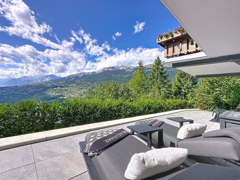 Modern outdoor furniture on terrace, outdoor furniture includes two lounge chairs and two side tables, stunning view of mountains