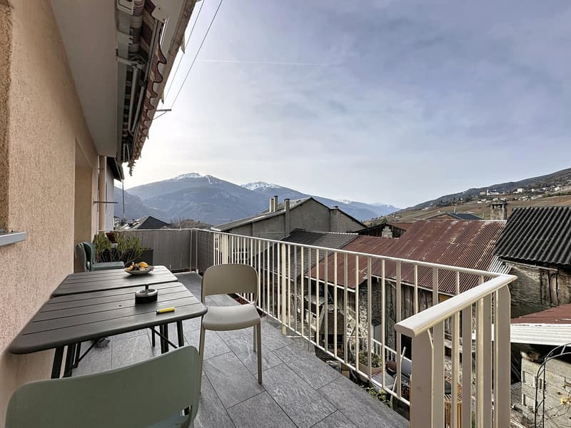 large terrace, city view, dining table, white chair