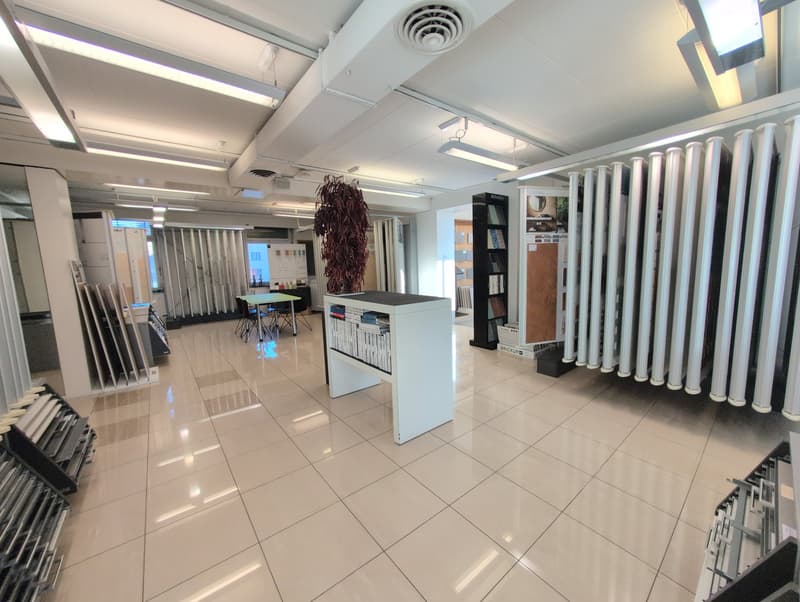 white tiled floor, ceiling lights, display items, white cabinet, bookshelf