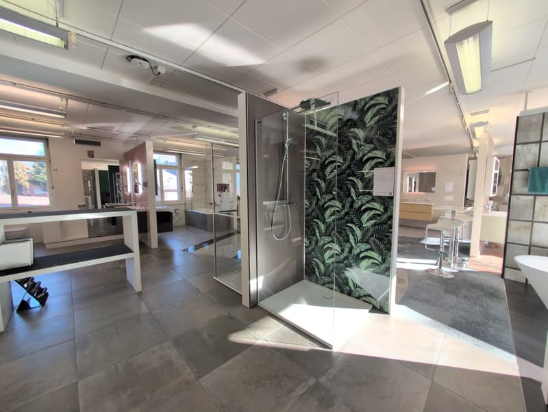 Modern bathroom with a glass shower, decorative wall tile, and a bathtub with an open window.
