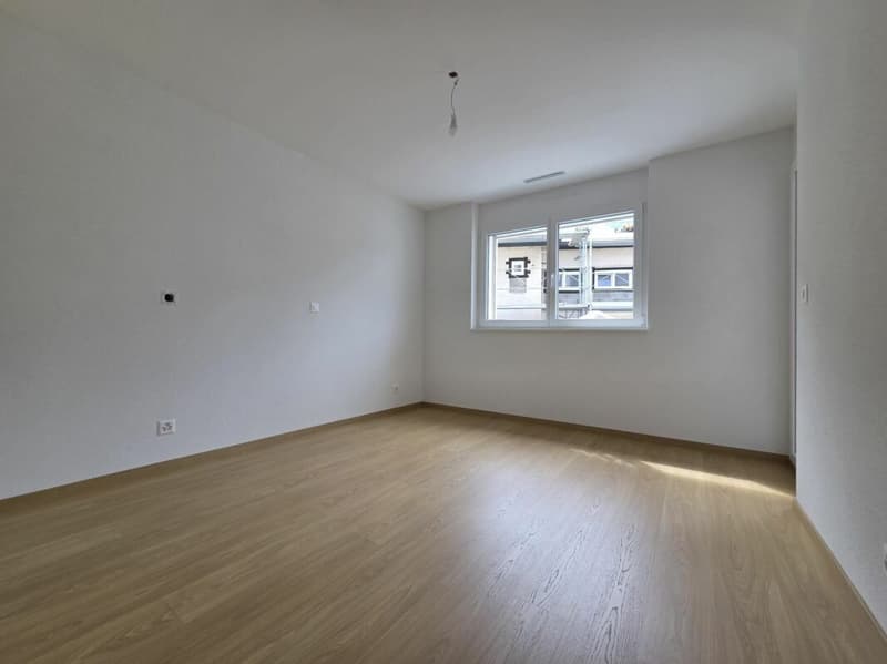 Neuf - Appartement de 2.5 pièces avec balcon et place de parc (5)