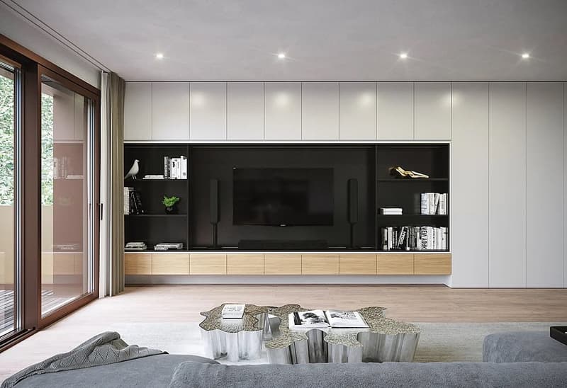 modern design with flat screen TV, built-in bookshelves, metallic center table, gray couches, sliding glass doors