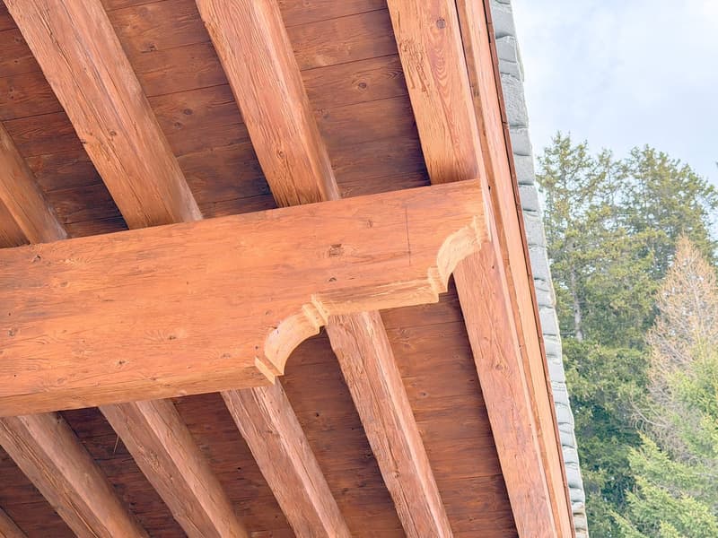 Close-up view of wooden beams and joints of a building, wooden texture, rustic aesthetic, outdoor environment